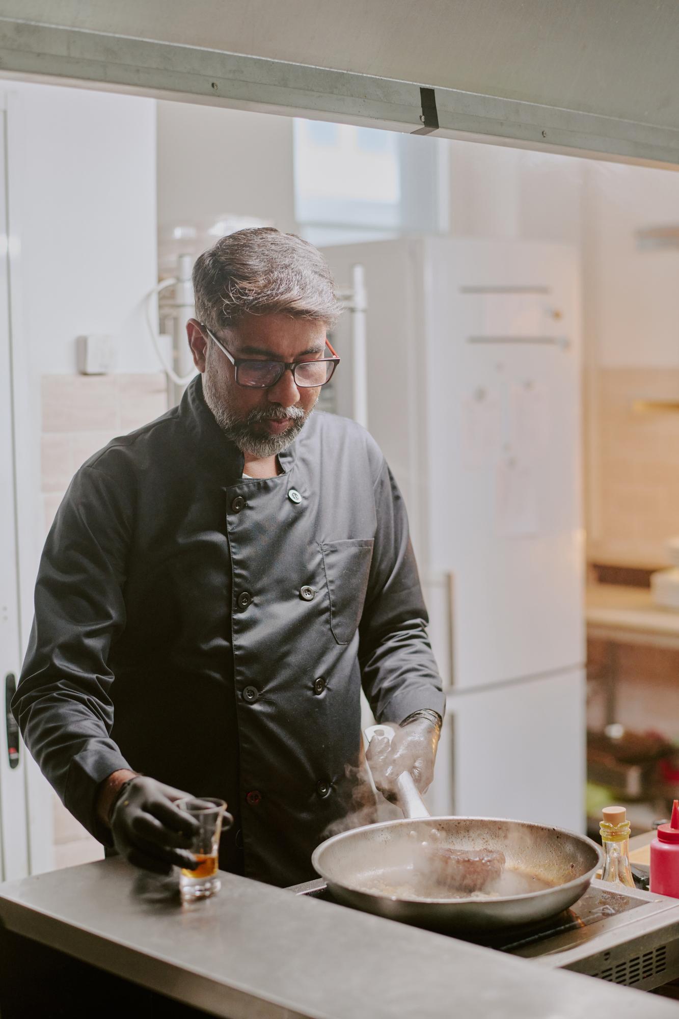 founder in kitchen studio arranging plates