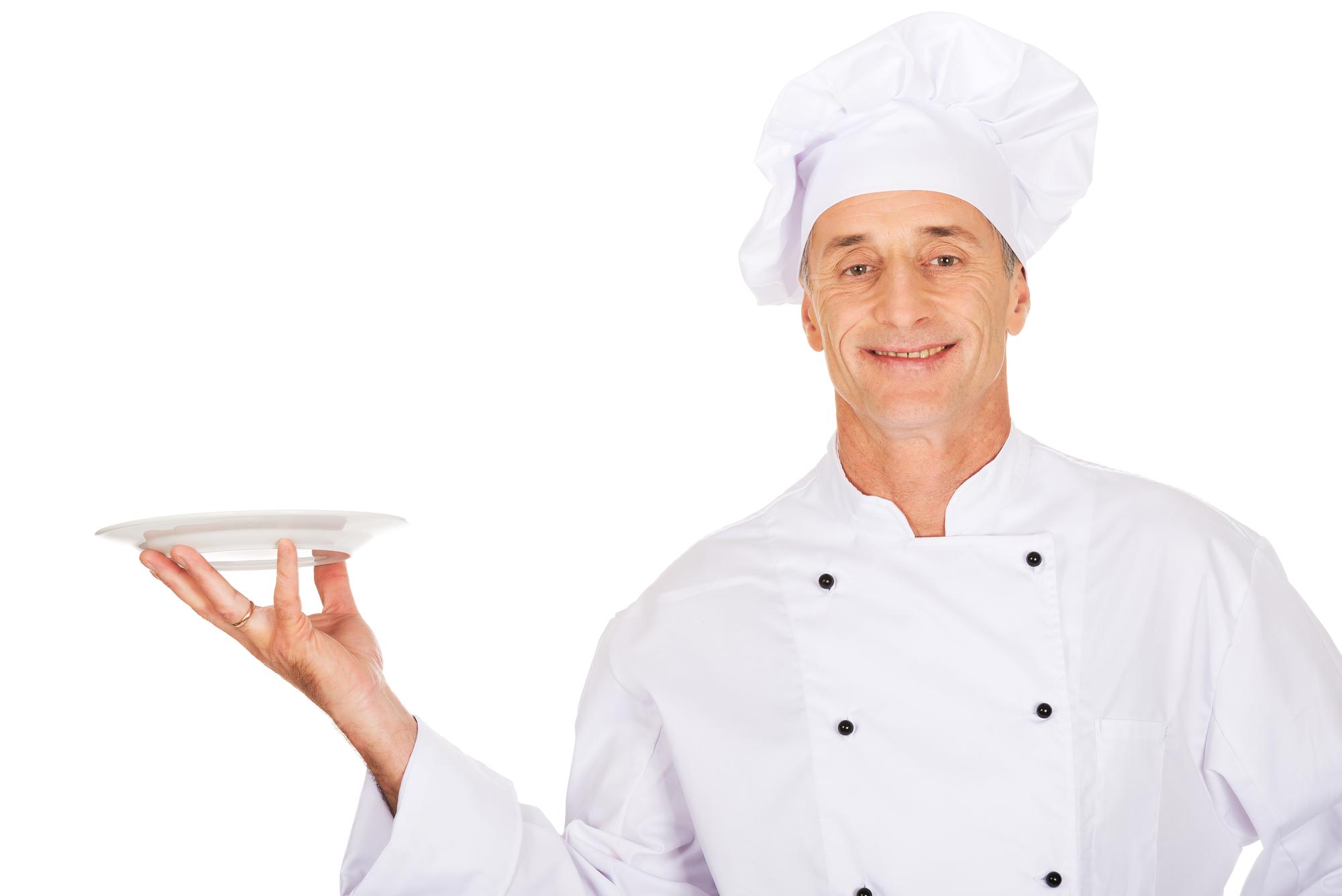 smiling chef with plated menu